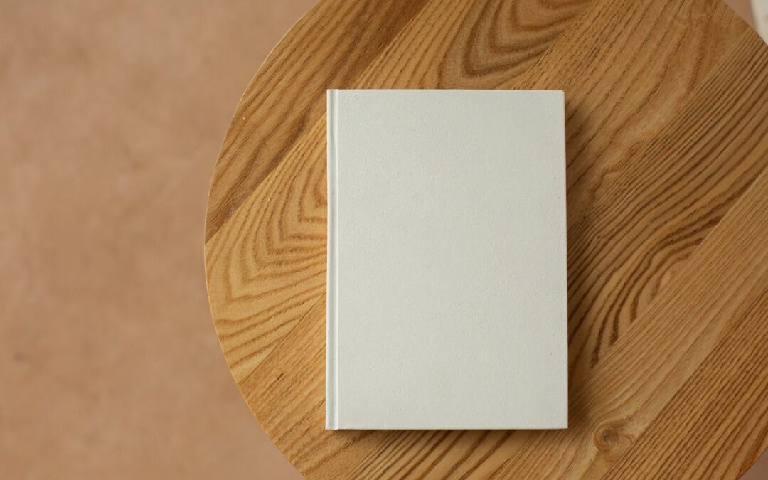 empty white book on wooden table